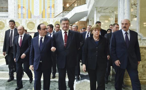 Belarus’ President Lukashenko, Russia’s President Putin, Ukraine’s President Poroshenko, Germany’s Chancellor Merkel and France’s President Hollande walk during peace talks in Minsk