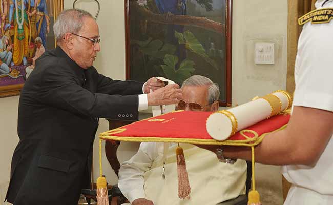 President of India, Pranab Mukherjee is seen conferring Bharat Ratna on Atal Behari Vajpayee at the latter's residence, March 27.