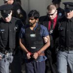 FILE- Raghunandan Yandamuri is escorted from a Montgomery County district court after a preliminary hearing (Associated Press photo)
