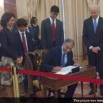 Indian-American Diplomat Puneet Talwar (sitting) sworn in as US Assistant Secretary for Bureau of Political-Military Affairs by US Vice President Joe Biden