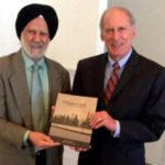 Dr. Hardarshan Singh Valia presenting his book entitled "Indiana Coals and the Steel Industry" to Indiana Senator Dan Coats