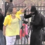 Graham is seen pulling her masked son away from a protest crowd