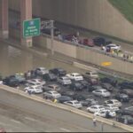 Flood waters submerged Texas highways and threatened more homes Friday, May 29 when a squall line stalled over Dallas overnight Thursday, dropping record-setting rainfall and triggering a Flash Flood Emergency