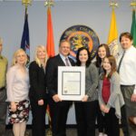 Mangano proclaims May Syringomyelia Awareness Month. Pictured (left to right): John Caemmerer, ASAP Board of Directors; ASAP Member Maureen Routledge; Patrice Schaublin, President Board of Directors; County Executive Ed Mangano; Shananne Hutter, LI-NY ASAP Support Group Leader, along with her family Katie, Sara and Stephen Hutter.