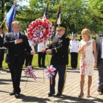 Nassau County Executive Edward Mangano (2nd left), County Legislator Laura Schaefer, keynote speaker Colonel Anthony Hartmann and United Veterans Organization’s President Rick Gales present a floral wreath at the 2015 United Veterans Organization’s Memorial Day Ceremonies at Veterans Plaza in Eisenhower Park.