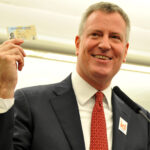NYC Mayor Bill de Blasio displays his IDNYC Card at the launch of the ambitious project of providing City ID to all residents