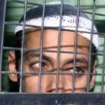 Salman Khan is seen seated inside a police van at Mumbai Sessions Courts which announced five years jail sentence to the actor in a 2002 hit and run incident in which one person was killed