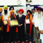 The management of Gurdwara Baba Makhan Shah Lobana , led by its President Himat Singh Sarpanch, honored Ambassador Dnyaneshwar Mulay, Consul General of India in New York, with a plaque, May 31, 2015. Also honored on the occasion were Cox & King Manager Ranjeet Singh and The Indian Panorama editor, Prof. Indrajit Singh Saluja.