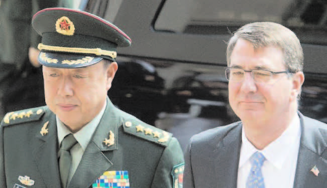 Pentagon chief urges China to stop island building Image