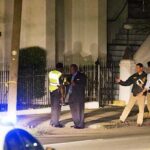 Police stand outside the Emanuel AME Church following a shooting on June 17, 2015, in Charleston, South Carolina. (Associated Press photo)