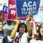 Supporters of the Affordable Care Act cheer outside the Supreme Court June 25 after the court threw out the challenge to the reach of the law.