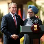 India's Prime Minister Dr. Manmohan Singh and US President George Bush shake hands after India and the United States sealed a civilian nuclear cooperation pact, in New Delhi