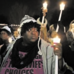 "Racial, gender and income inequalities are still factors that prove to be obstacles to substantive social justice." This Reuter photo shows people holding a protest demonstration outside Ferguson Police Department.