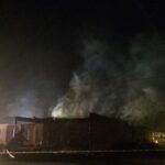 Smoke rises from Mount Zion African Methodist Episcopal church Wednesday, July 1, 2015, in Greeleyville, S.C., which caught fire Tuesday. The African-American church that was burned down by the Ku Klux Klan in 1995 caught fire again Tuesday night. (Veasey Conway/The Morning News via AP)
