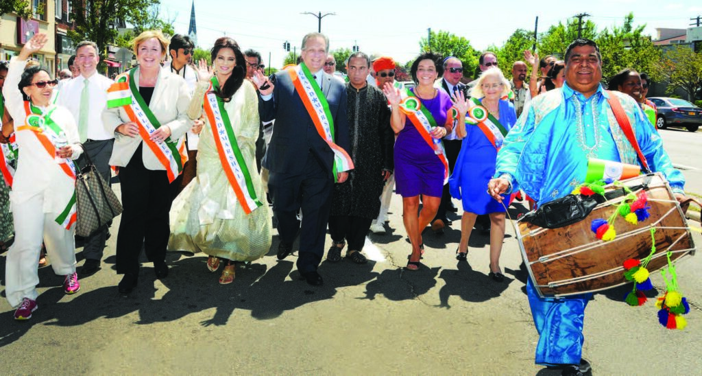 Leading the parade, to the drumbeat. In the front row, from L to R: Indu Jaiswal, Kate Murray, Grand Marshall Neetu Chandra, Ed Mangano, Bobby Kalottee , Linda Mangano, and Judy Bodsworth