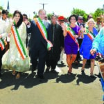 Leading the parade, to the drumbeat. In the front row, from L to R: Indu Jaiswal, Kate Murray, Grand Marshall Neetu Chandra, Ed Mangano, Bobby Kalottee , Linda Mangano, and Judy Bodsworth