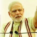 Prime Minister Narendra Modi addressing a gathering at Dubai Cricket Stadium.