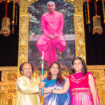 Kavita Krishnamurthy (Centre) holding Peace Torch with Dr L. Subramaniyam and their daughter Bindu at the Concert hall