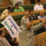 Engineer Rashid, an Independent MLA, holds a banner as he disrupts the first day of the Jammu and Kashmir assembly session in Srinagar.