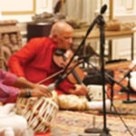 Pt. Dinesh Kumar Prabhakar (center) performs. He is accompanied on Tabla by Avirodh Sharma (left) and on Violin Daljeet Singh Sokhey (right).