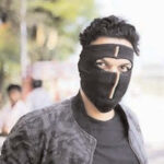 Masked man kills