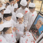 Children pay floral tributes to Chacha Nehru