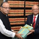 Union Finance Minister Arun Jaitley receives the Seventh Pay Commission Report from the chairman, Ashok Kumar Mathur, in New Delhi.