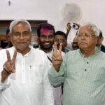 Kumar, a leader of Janata Dal (United) and Chief Minister of eastern state of Bihar, and Lalu Prasad Yadav, chief of Rashtriya Janata Dal, gesture after addressing a news conference in Patna