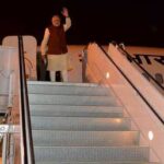 Prime Minister Narendra Modi waves from a plane after meeting his Pakistan counterpart Nawaz Sharif in Lahore on Friday. REUTERS