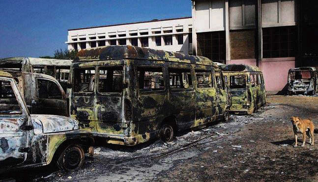 Charred vehicles pile up in Rohtak.