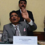 Justice Lodha (center) with the other two committee members at a press conference in New Delhi.