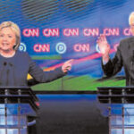Democratic presidential candidate Senator Bernie Sanders (right) and Democratic presidential candidate Hillary Clinton speak during the CNN Democratic Presidential Primary Debate at the Cultural Center Campus, Michigan