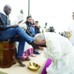 Pope washes asylum seekers’ feet
