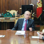Photo caption:Russian President Vladimir Putin (C) meets Defense Minister Sergei Shoigu (R) and Foreign Minister Sergei Lavrov (L). Putin ordered the defense ministry to begin the withdrawal of Russian forces from Syria. (AFP)