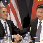 U.S. President Barack Obama shakes hands with Chinese President Xi Jinping during their meeting at the start of the climate summit in Paris last year (File photo)