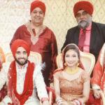 The newlyweds Pavneet and Sahil (seated) with their parents. Standing, L to R: Mrs. Homa Mehra, Mr. Parvesh Mehra, Mr. Mohinder S Taneja and Mrs. Dimpy Taneja