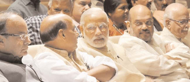 PM Narendra Modi with BJP ministers and party veteran LK Advani