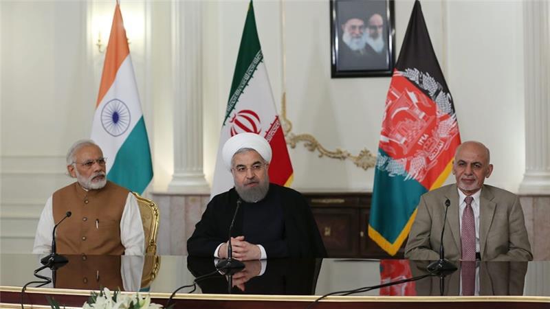 Rouhani, centre, hosts a meeting with the Indian Prime Minister, Narendra Modi, left, and Afghan President