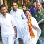 TMC chief Mamata Banerjee was sworn in as Chief Minister of West Bengal on Friday, May 27. Here she is seen with her party men during election campaign ~ File photo