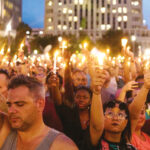 Thousands gathered in downtown Orlando June 13 night for the city’s first official vigil since Sunday’s mass shooting at a gay nightclub, which killed and wounded dozens.