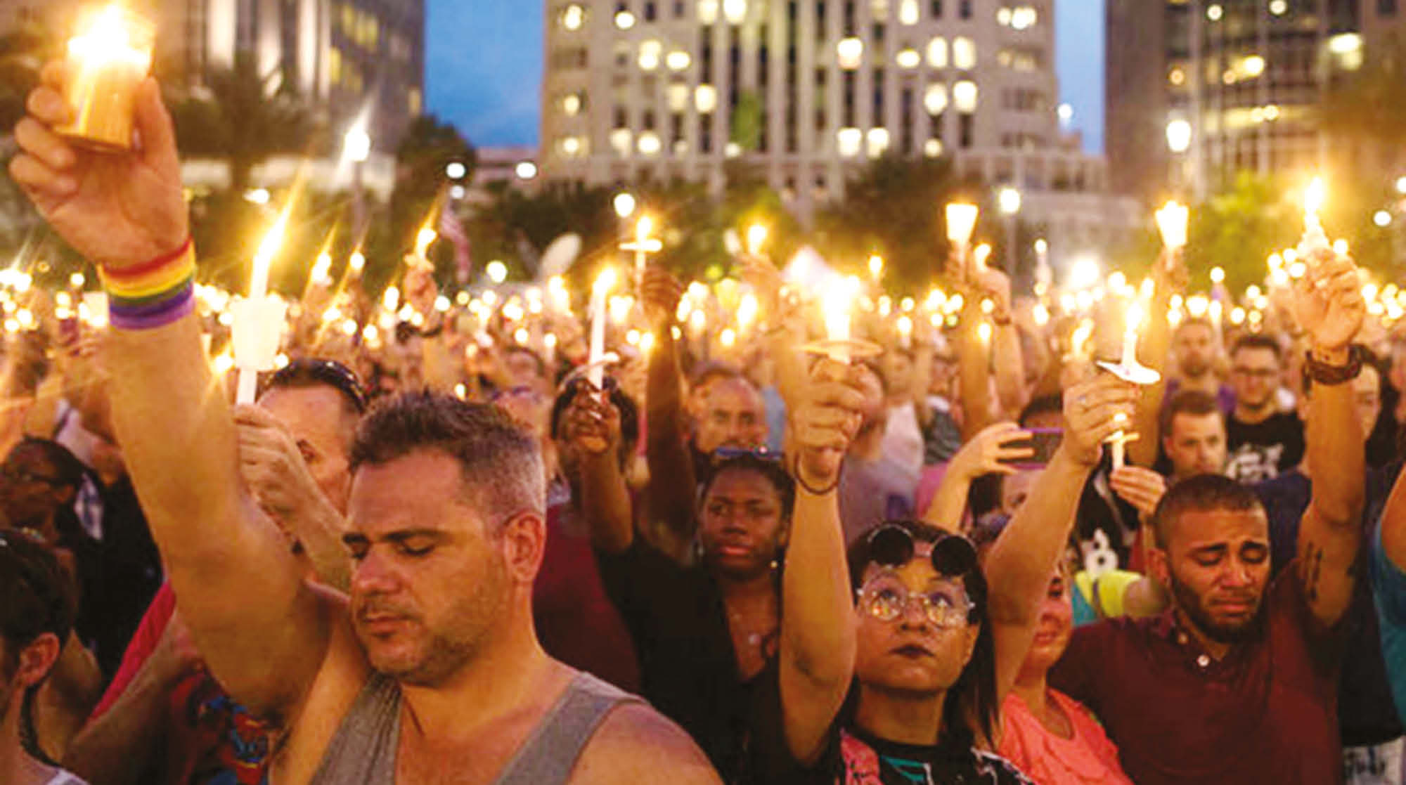 Thousands gathered in downtown Orlando June 13 night for the city’s first official vigil since Sunday’s mass shooting at a gay nightclub, which killed and wounded dozens.