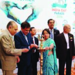 Ambassador Riva Ganguly Das and FIA officials light the lamp to kick off the 36th India Day Parade, scheduled for August 21