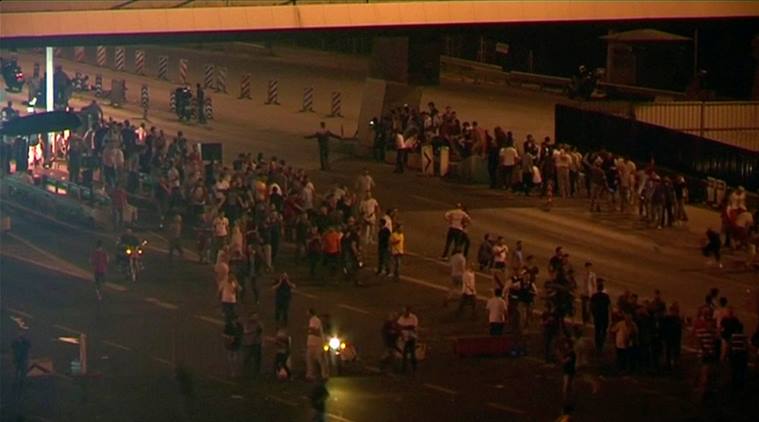 Still frame taken from video shows people gathering along the road to the Bosphorus Bridge in Istanbul, during an attempted coup in Turkey