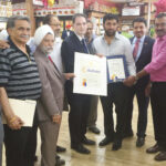Mr. Dilip Chauhan, Director with Nassau County Comptroller's Office, presenting a citation to Amandeep Singh Toni, on behalf of Nassau County.