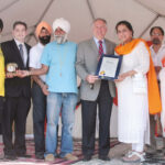 Mr. George Maragos, Nassau County Comptroller presents Nassau County Citation to Vaisakhi Mela organizers. Also seen in the picture is Mr. Dilip Chauhan, Director in the office of the Comptroller