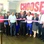 Checkers Grand Opening: Assemblyman David Weprin, partners Bhupider Singh and Manjit Singh, General Manager Monica Singh, and staff members at the grand opening of Checkers