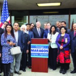 George Maragos with community leaders by his side announced to press, September 29 that he had changed his party registration to Democrat