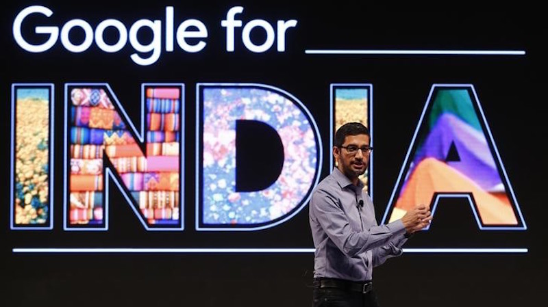 Google CEO Pichai gestures as he addresses a news conference in New Delhi