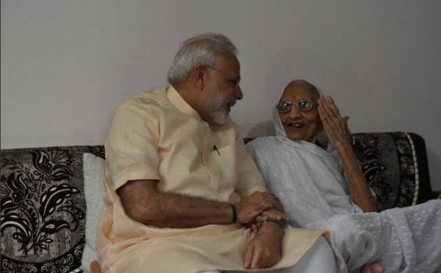 modi-takes-blessings-of-mother-on-66th-birthday