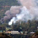 IMAGE: Smoke rises from the Uri Brigade camp during the September 18, 2016 terror attack. Photograph: Umar Ganie